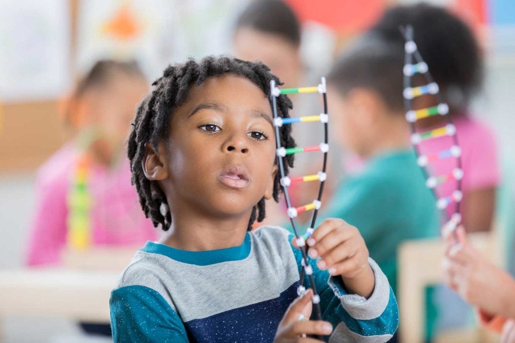 Preschool boy with science activity