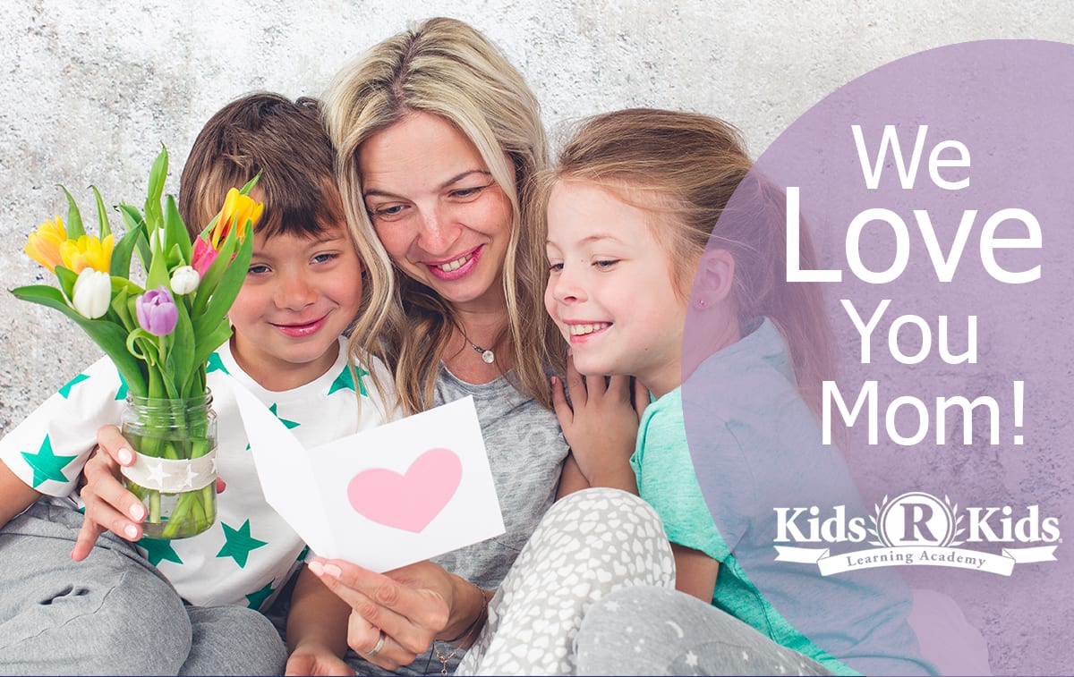 Preschool kids giving mom a card